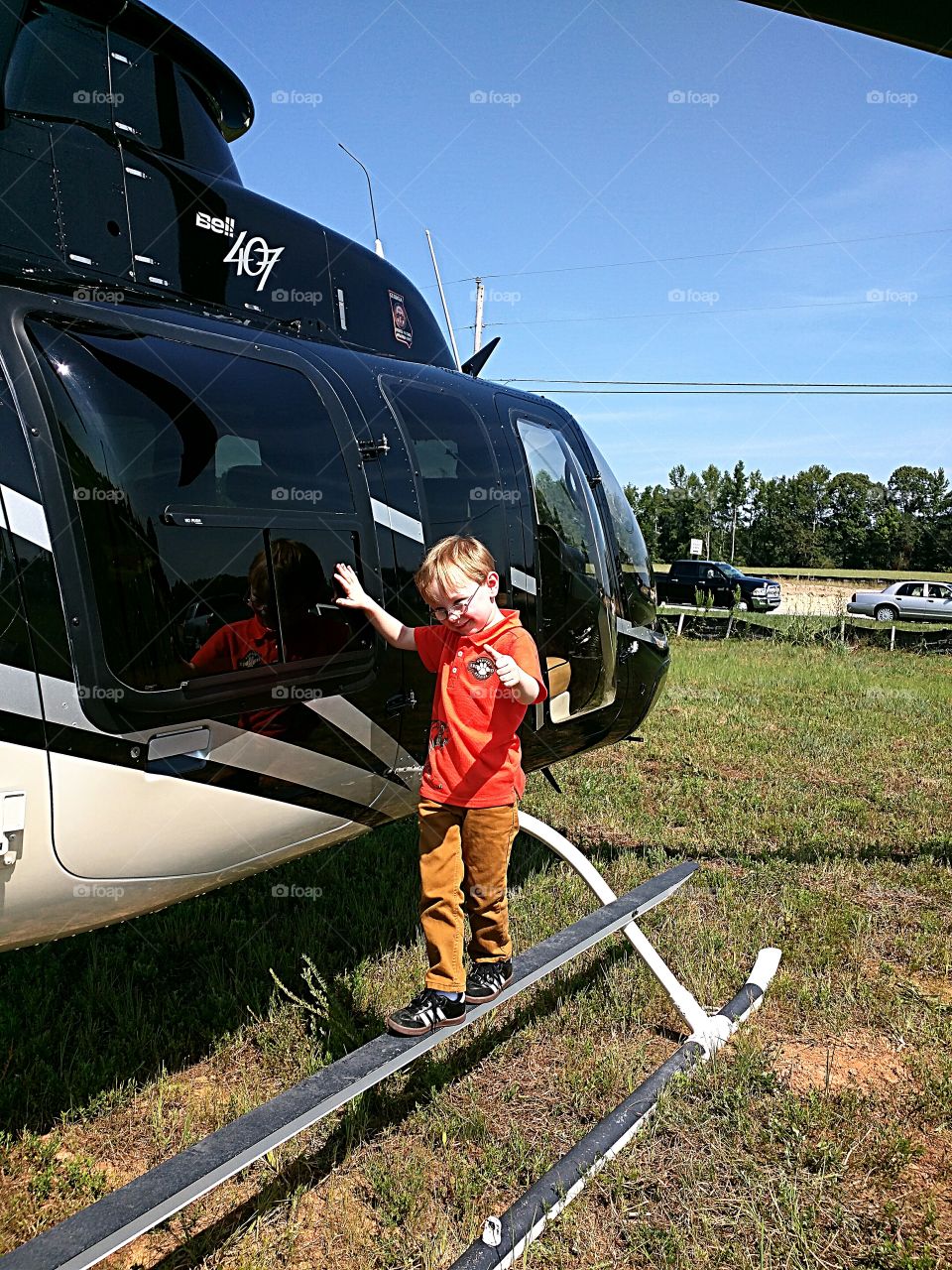 Rio: River will most likely never fly a helicopter. Despite this clearly staged photo, he is actually quite unnerved by most things mobile. Two feet already firmly on the ground, he is a circumspect five year old who prefers books and movies and make believe.