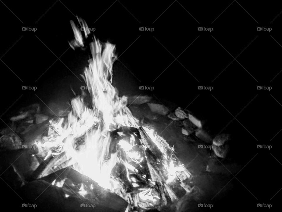 My fiance loves to hang out at the fire pit in the back yard. Fires almost always look interesting in that that they always seem to tell a story. That is why I snapped this photo the last time we had one. It tells a different story in black & white.