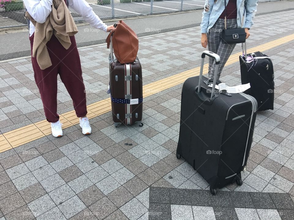 Trendy Girls Waiting with Luggage