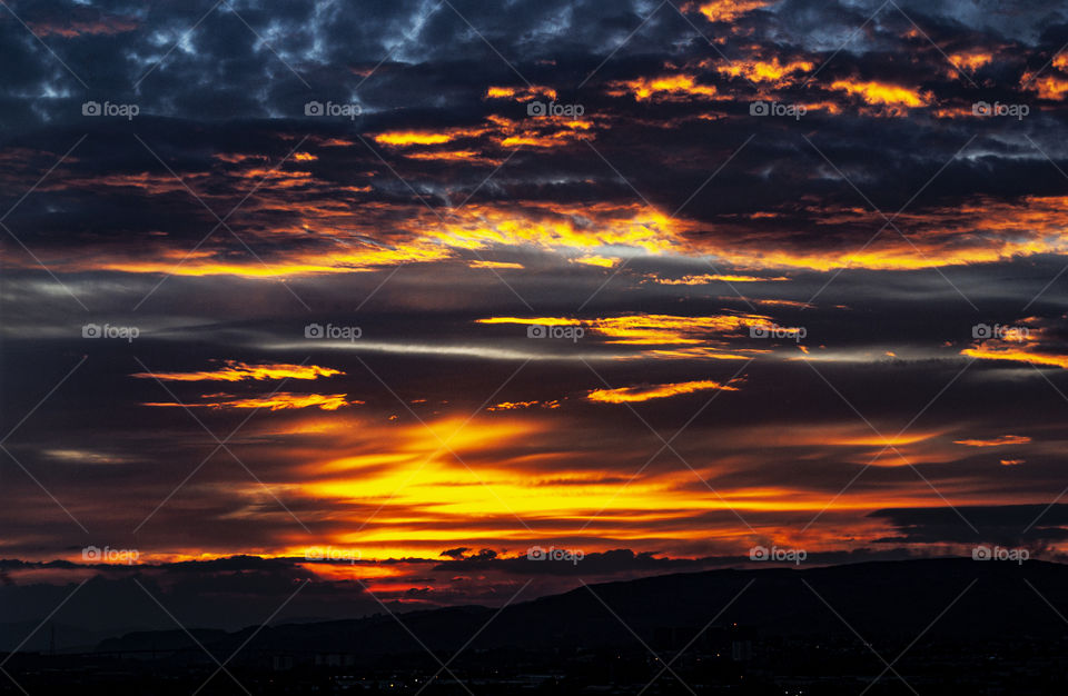 A colorful dramatic sky  with the setting Sun.