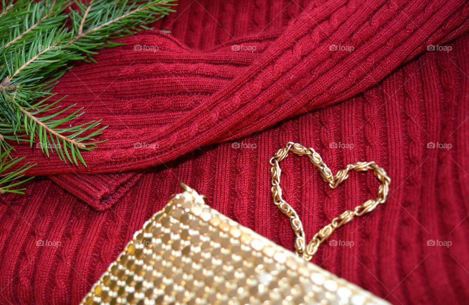 Red textile with fir leaf and hand bag