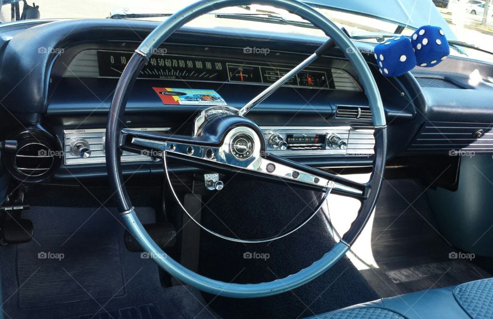 vintage dash. at a vintage car show, loved this simply designed dashboard and huge steering wheel. 