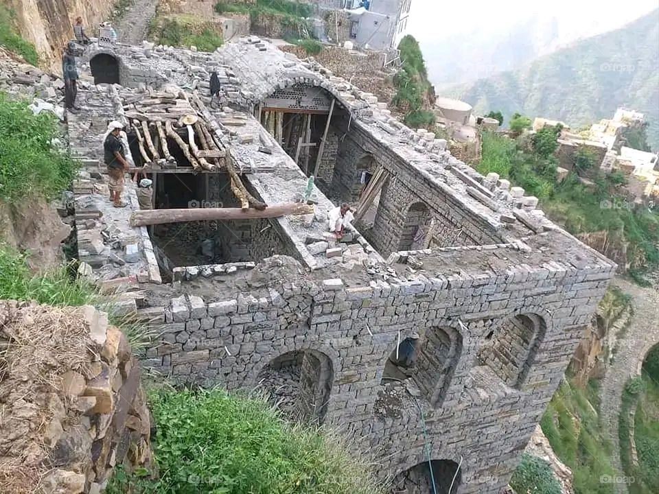 A stunning view of green mountains covered in fog in Yemen