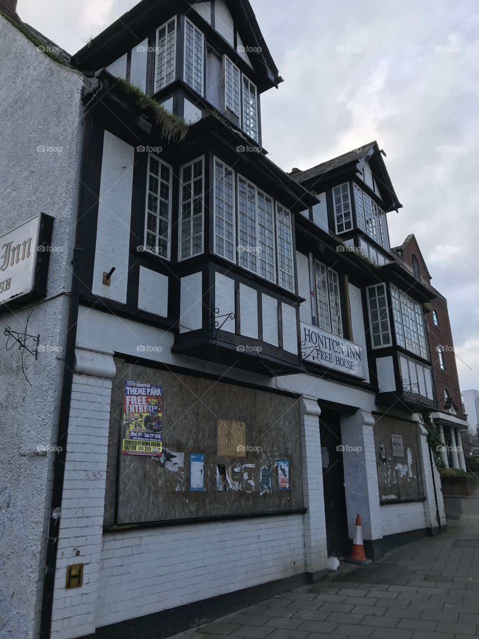 Front view of this once beautiful building, no longer bothered with or cared for.