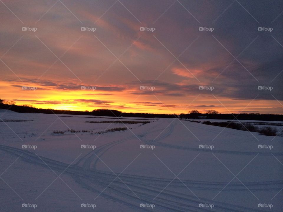 Sunset over the frozen land