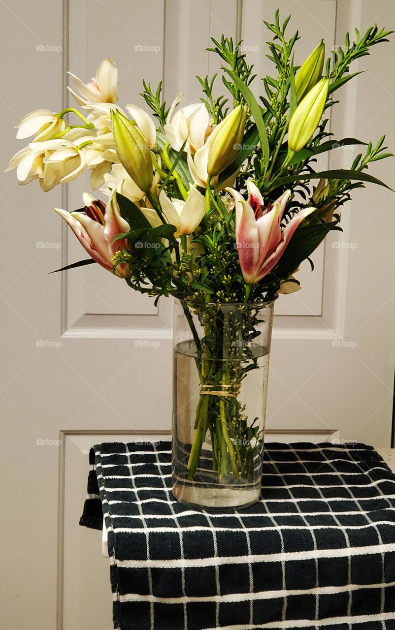 beautiful bouquet of Spring flowers in a vase from spouse as a surprise anniversary gift