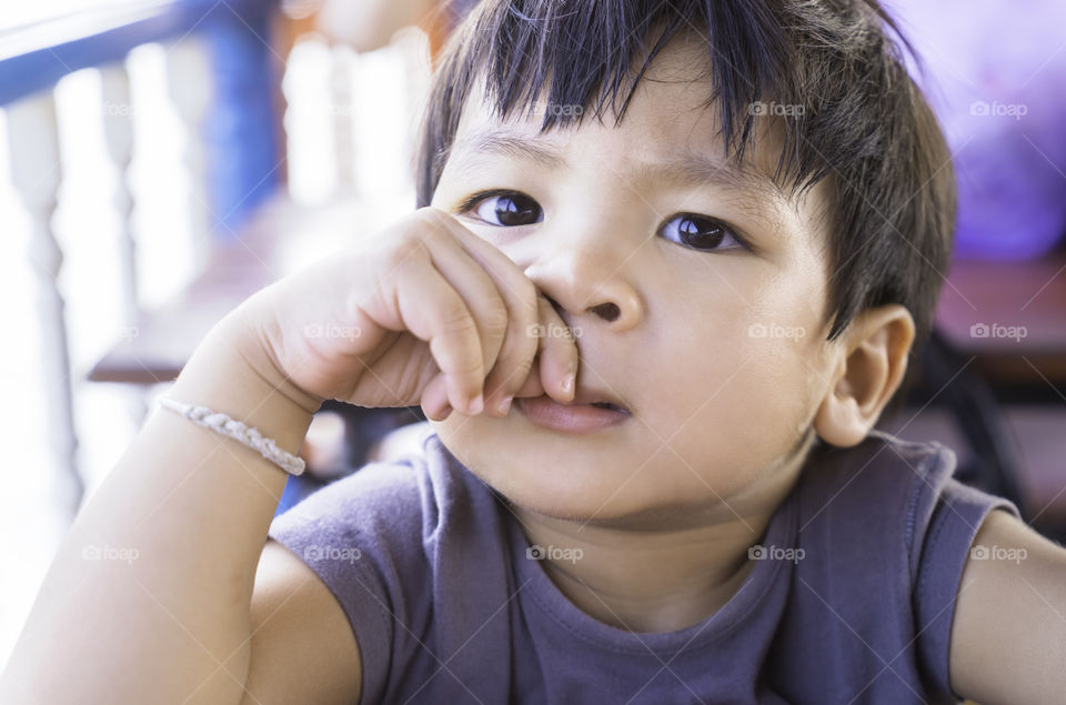 Asian boy looking at you