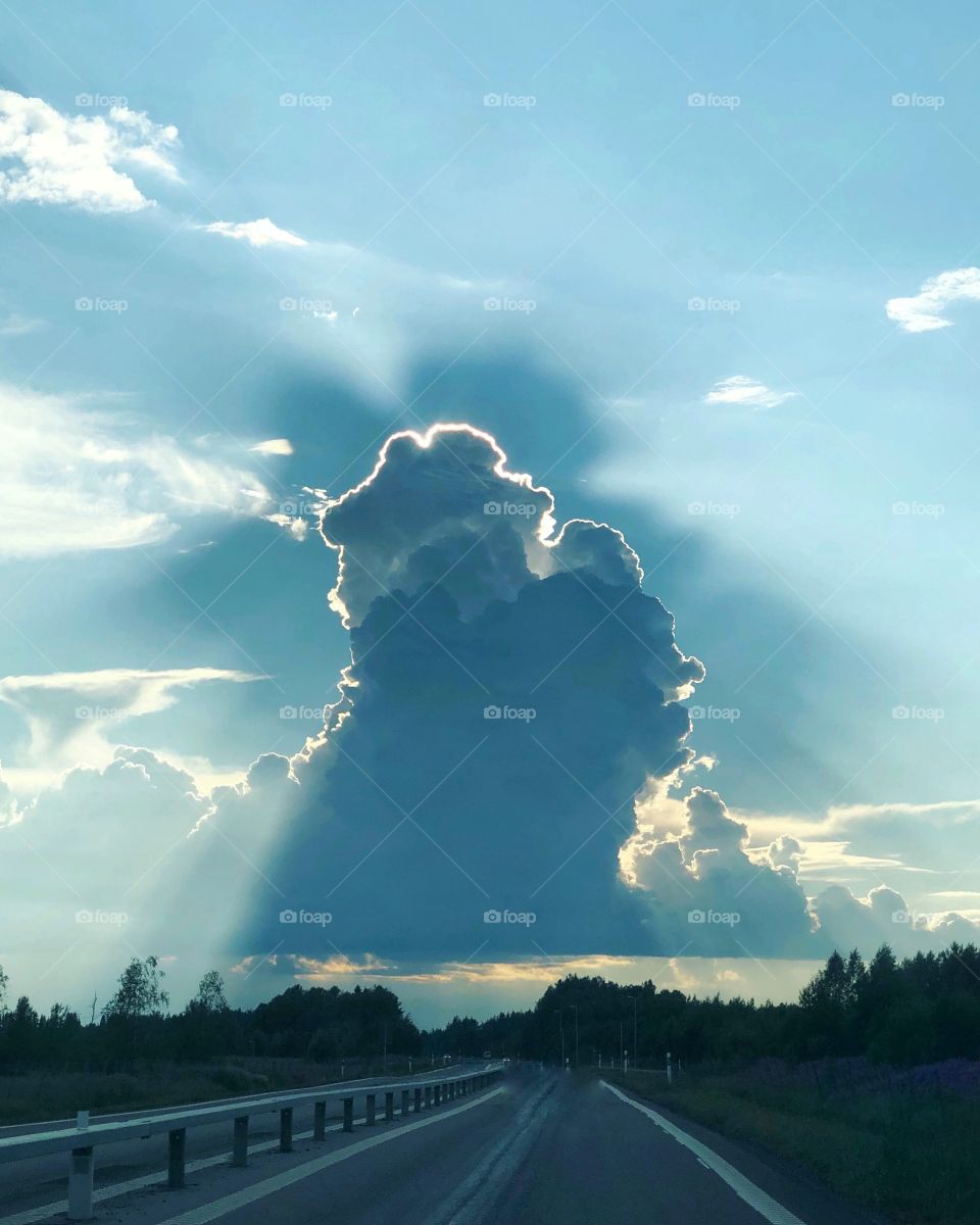 Sun behind the cloud
