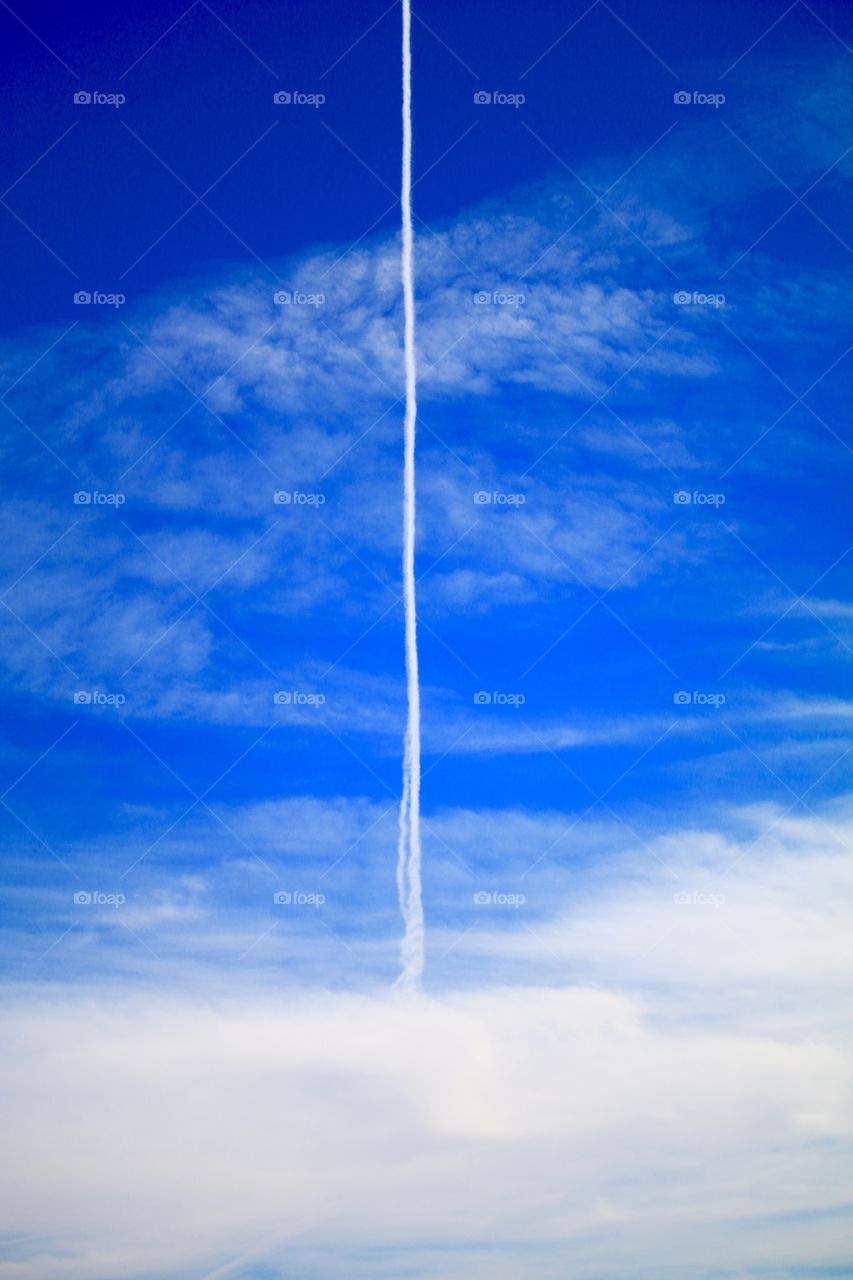 Jet stream on a bright blue sky 