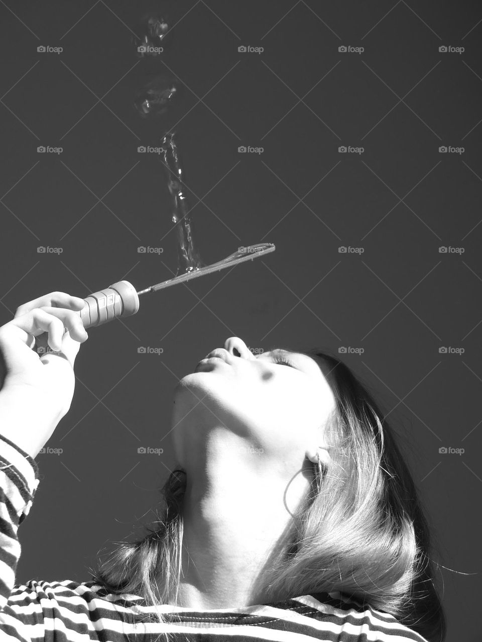 Moments in Black & White. soap bubbles, girl blowing soap bubbles