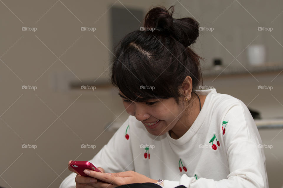 Girl playing smartphone 