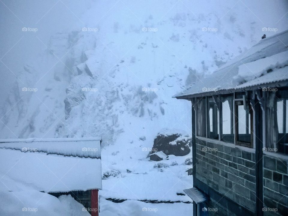 Stuck in a snow storm at Machapuchare Base Camp on the way to Annapurna. Photo taken on the Annapurna Base Camp Trek in Nepal.