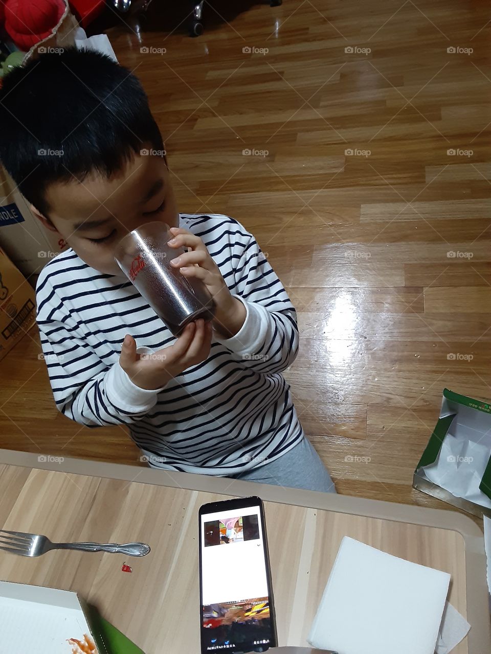 drinking his favorate coca cola