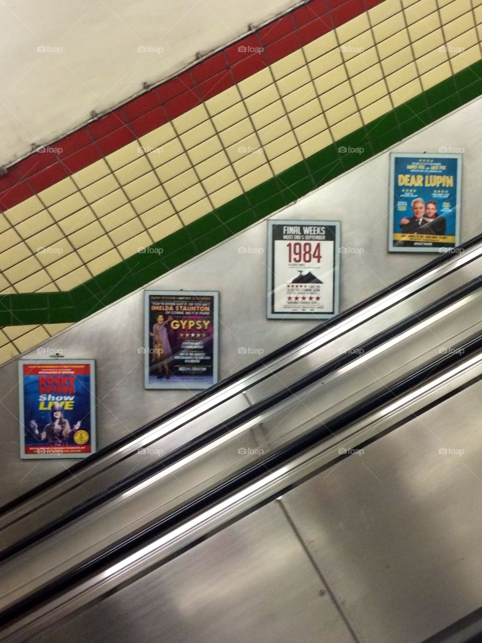 Underground Ads. The interior of many tube stations in London feature these local ads for West End shows. Something pleasing about it!
