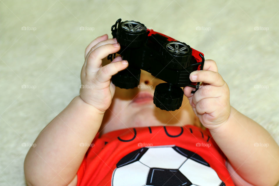 car in the hands of a child