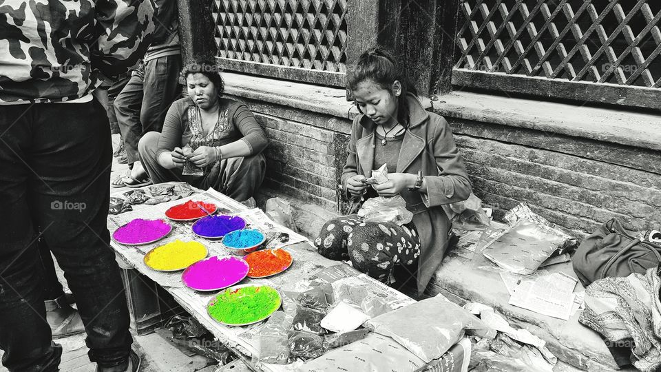 A color powder seller at the corner of the street of Nepal when the Holi Festival