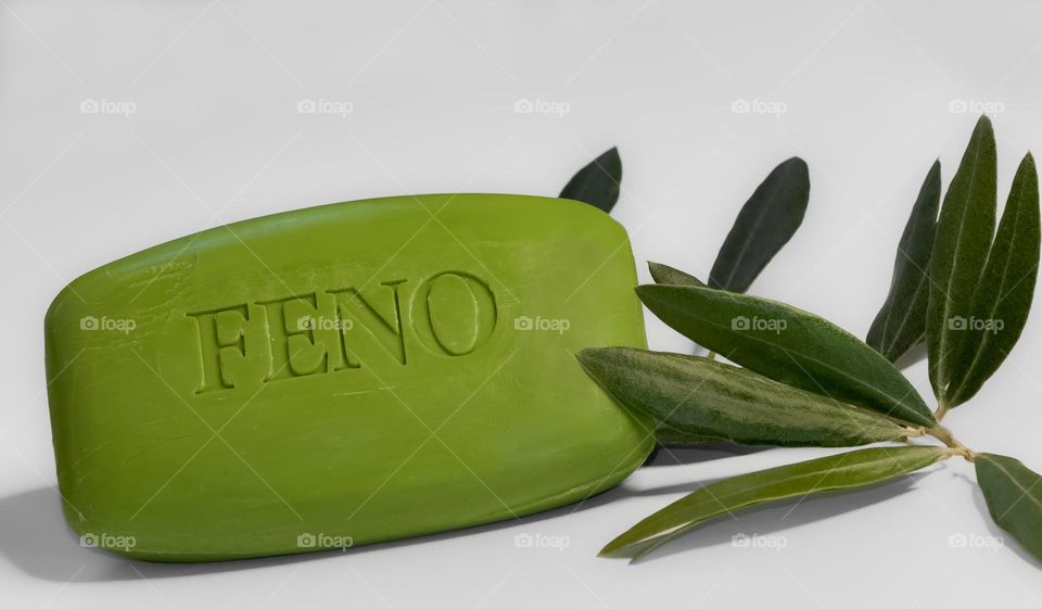 Portuguese Feno soap with olive leaves on white background 