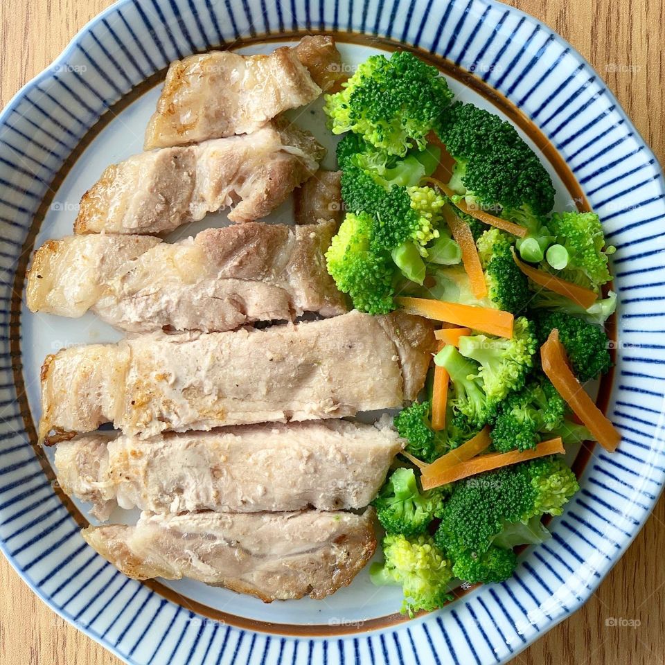 Pork loin steak with broccoli and carrots for lunch or dinner 