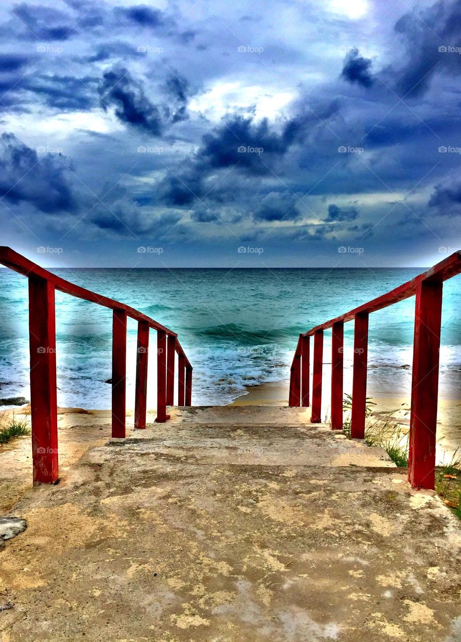 Staircase to the ocean, stairs leading down to the seashore, stairs made of stone, stairs leading to paradise, the calm after the storm, afterwards 