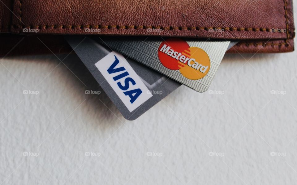 Close up of credit cards in a leather wallet.