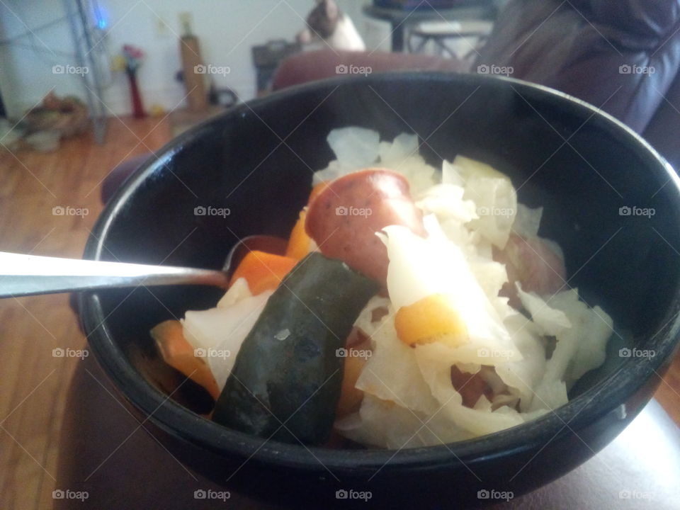 cabbage,carrots,bell peppers and smoked sausage good healthy meal for the the evening.