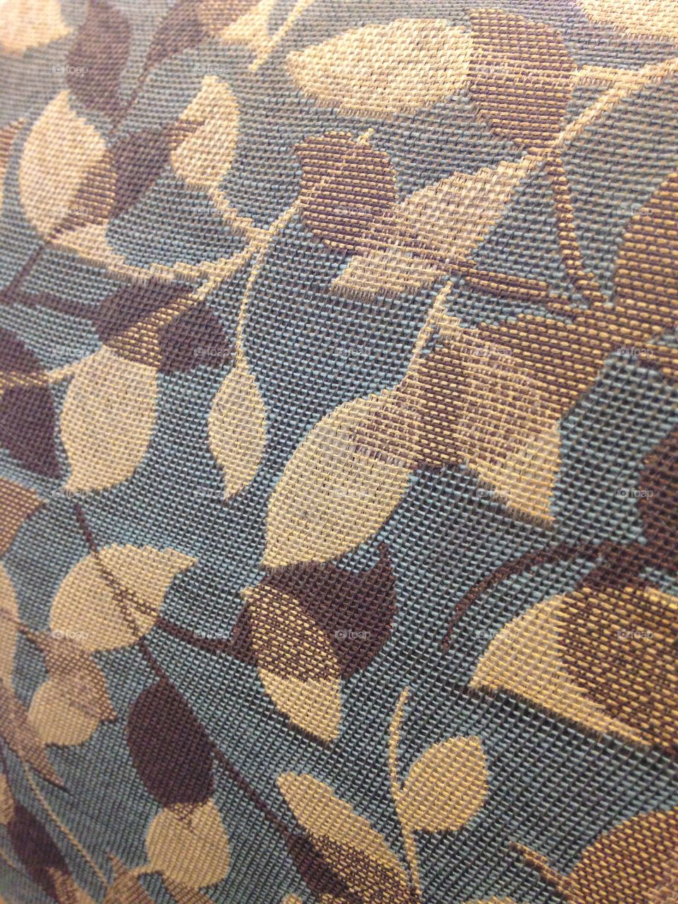 Textured floral pattern background, muted blue and brown hues