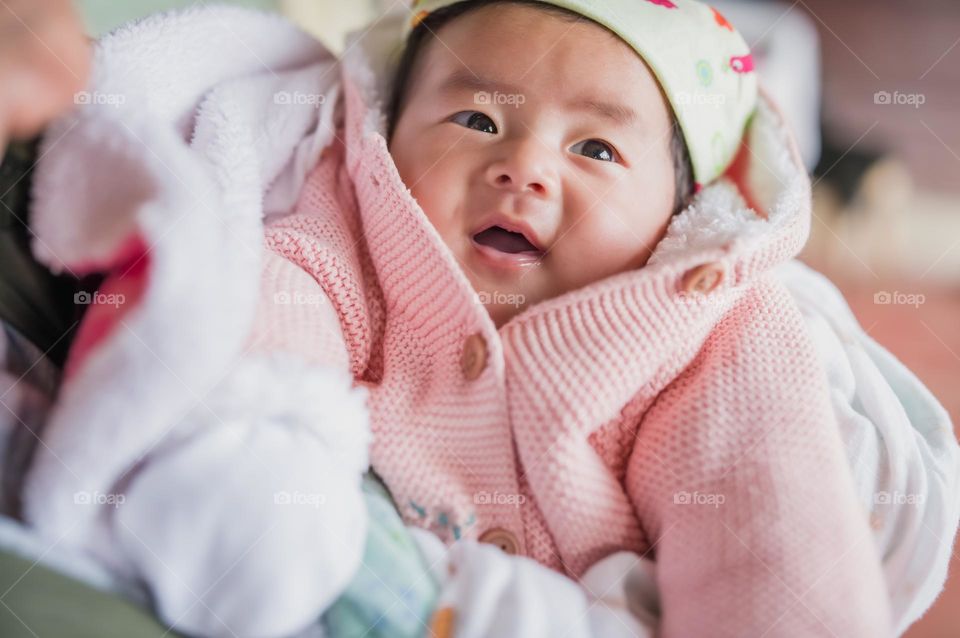 A little baby girl in baby pink