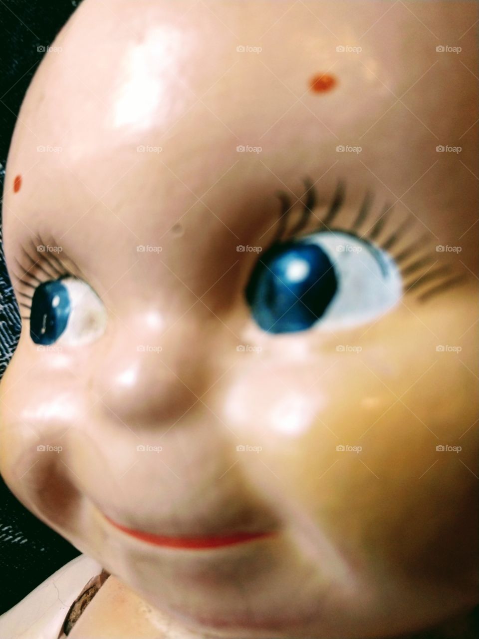 Kewpie doll profile smile