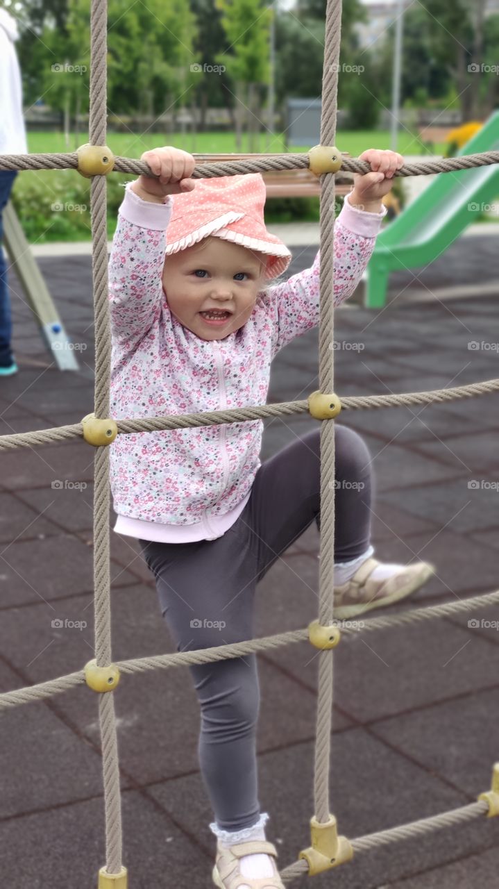 Kids playground Girl climbing