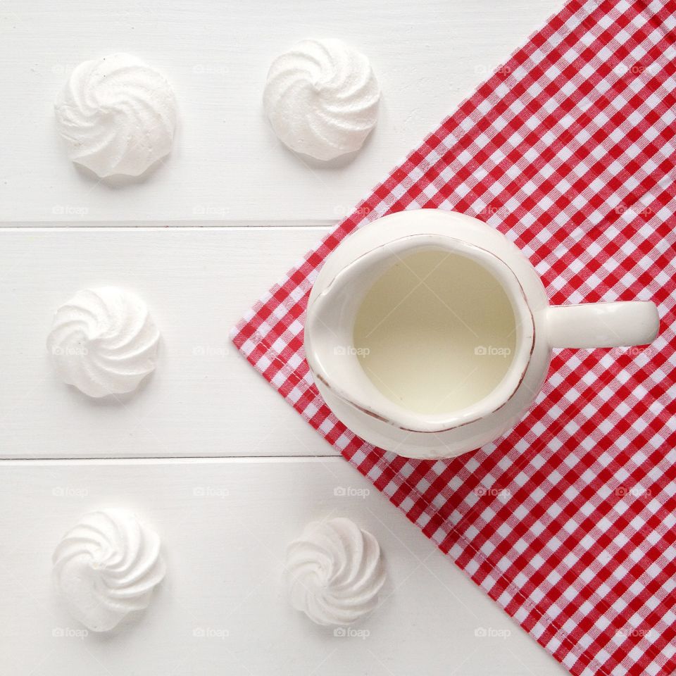 High angle view of milk and whipped crean