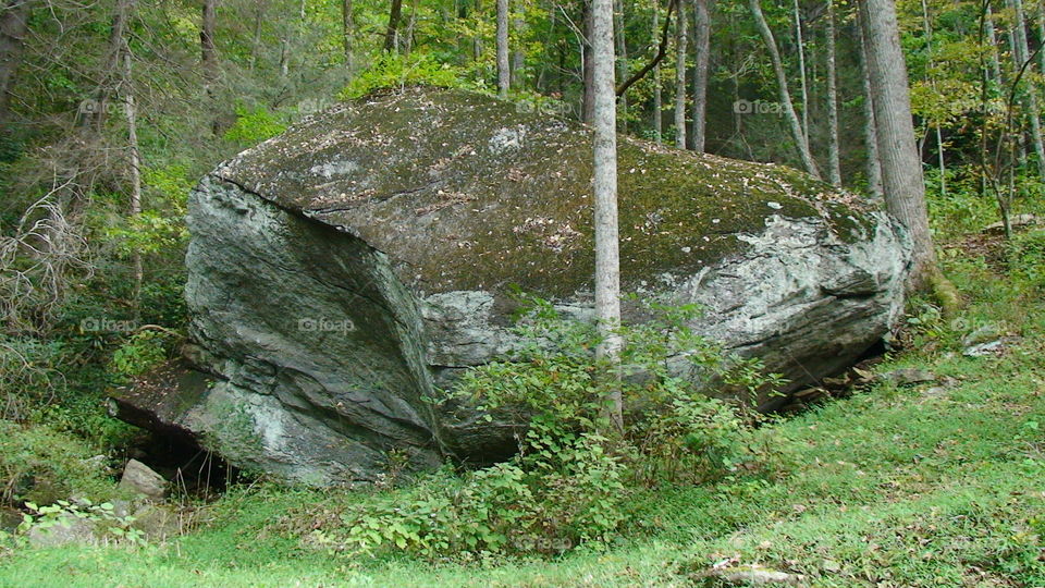 Giant rock on side of mountain 
