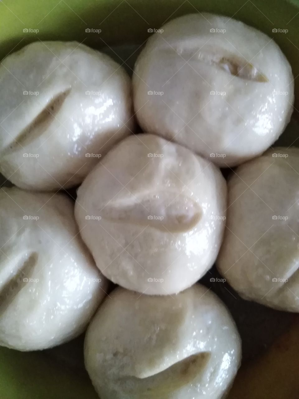 Buns from yeast dough with an incision.