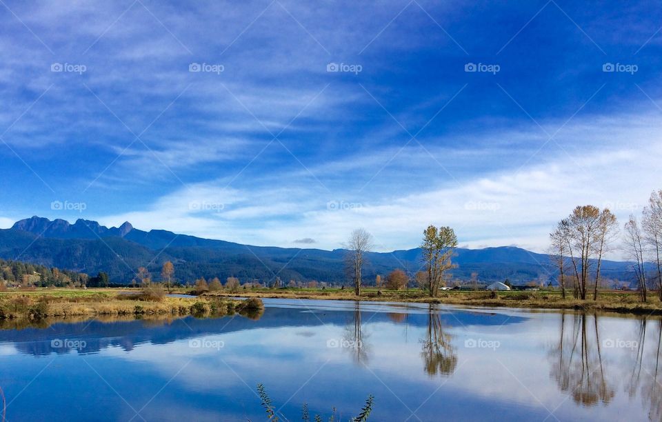 Cloud reflecting on lake