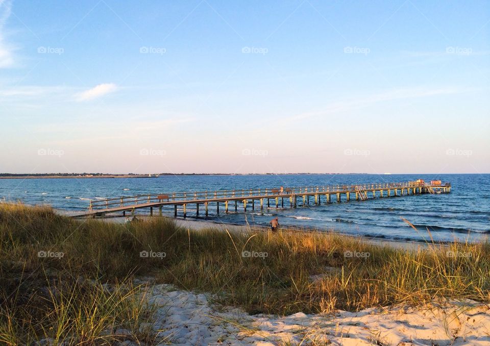 Wooden pier over blue sea