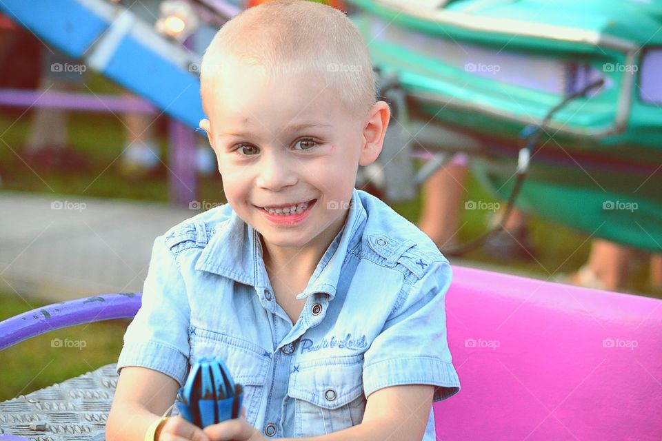 Happy. Boy on funfair