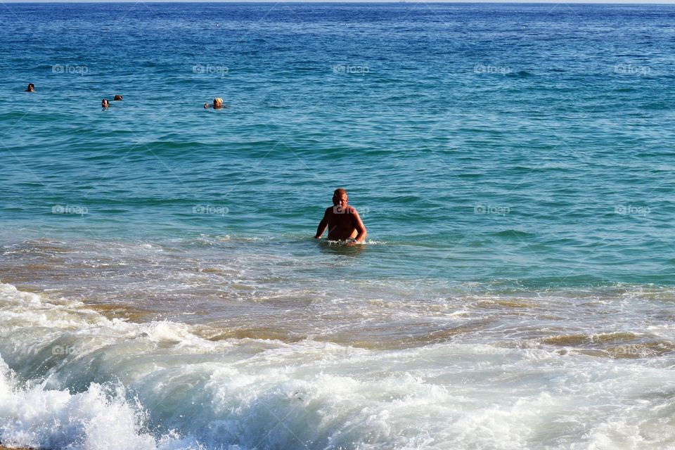 Portrait of a man swimming in sea
