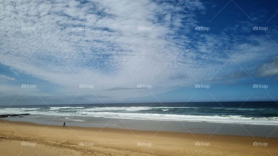 beautiful stretch of beach and calm seas.