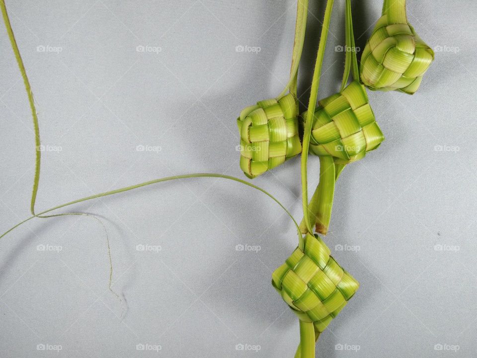 ketupat for Ramadan and Eid Al Fitr food and decorations.  made from woven coconut leaves