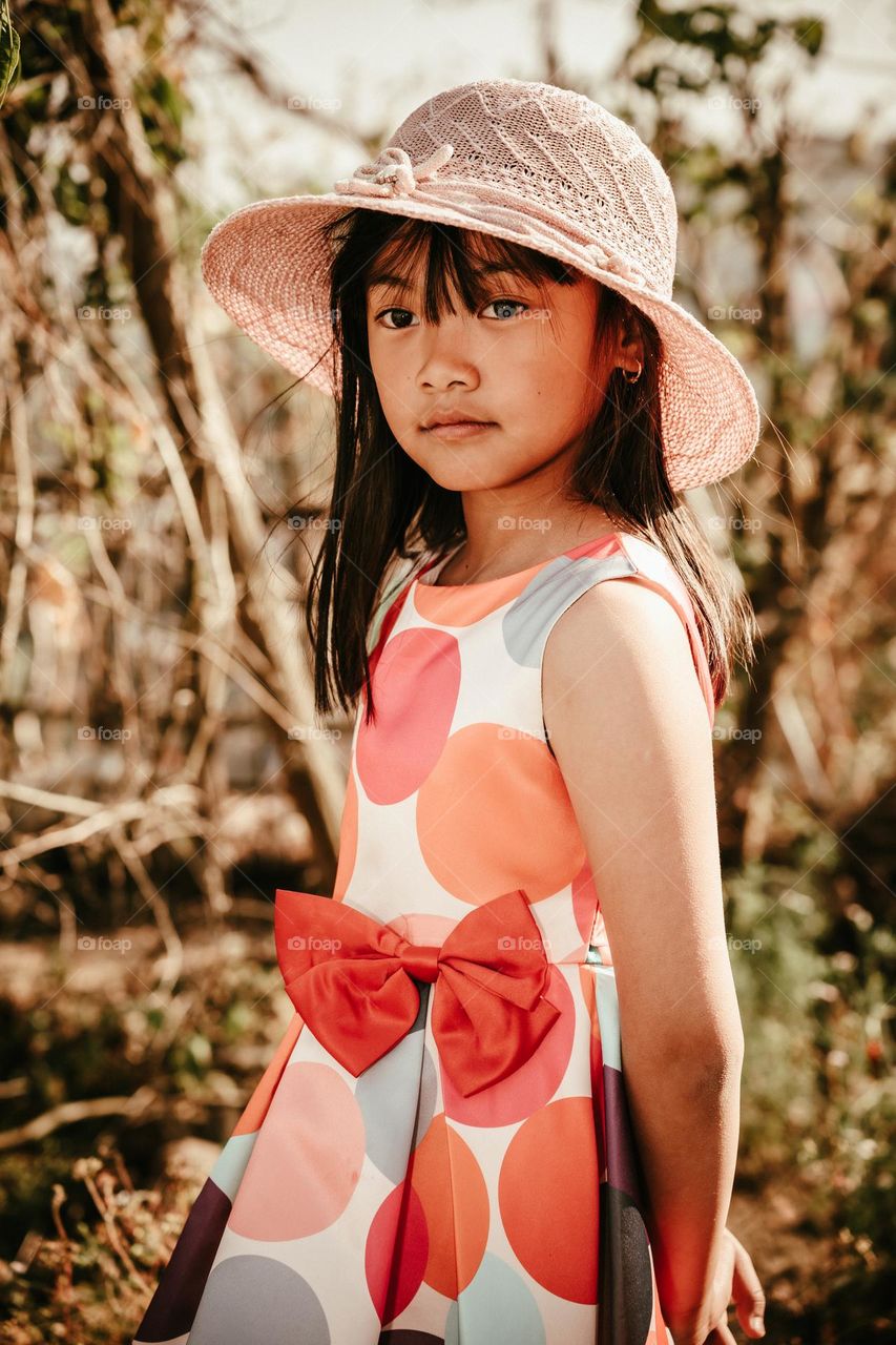 Vintage inspired portrait of a young little girl.