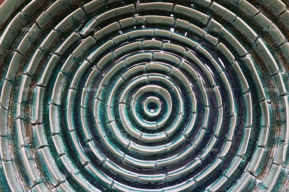 Unusual decorative plate ...vertical pieces of pottery made into a curve ... beautiful green blue accents ... not sure what it was used for but Iβm thinking ... an arrangement of olives ? Entered into the shapes mission ....ππ