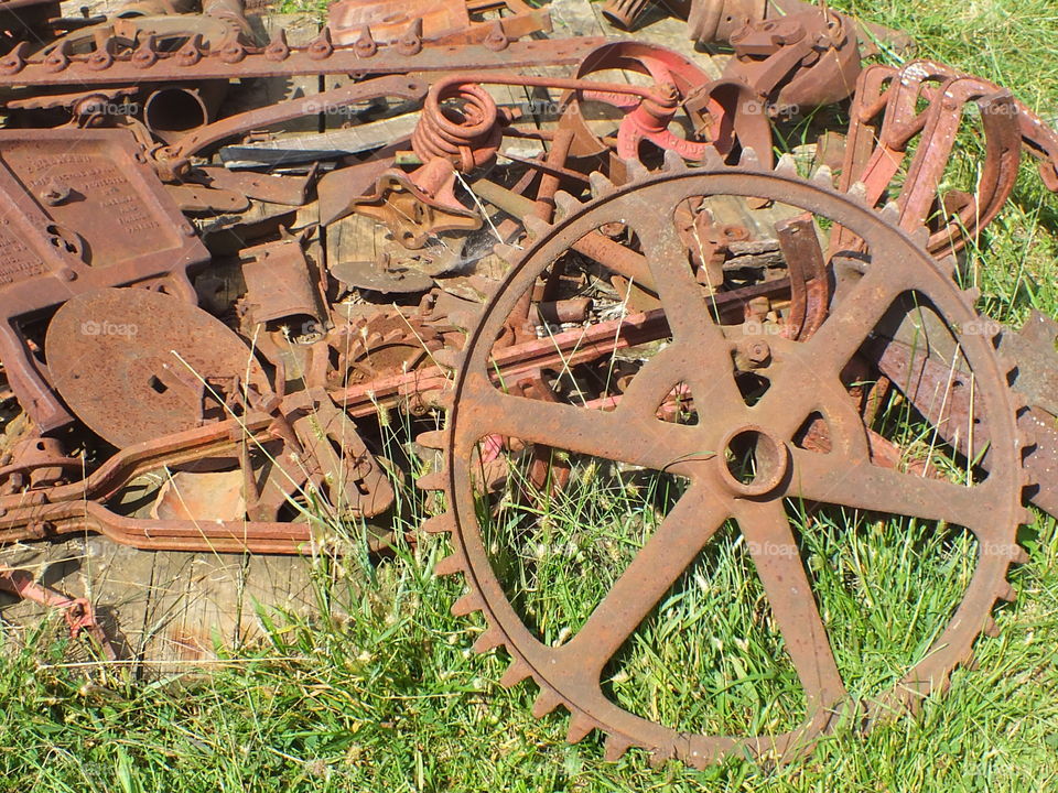 Old farm equipment pieces. Old metal farm equipment pieces or maybe junk.