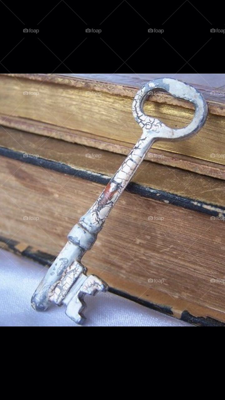 Skeleton key and old book