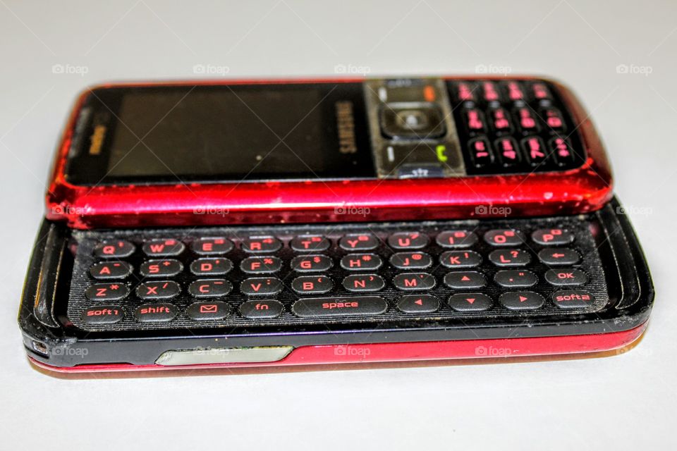 Old scratched Red Key phone