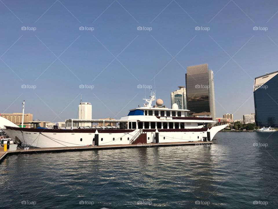 Yacht docked by the jetty at the Dubai Creek Side