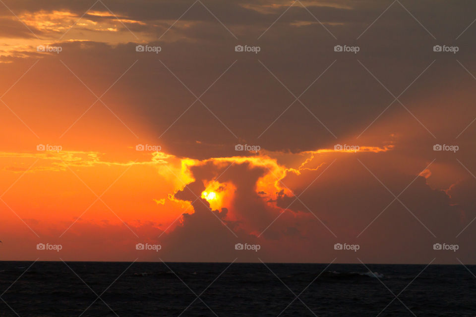 sun set behind clouds