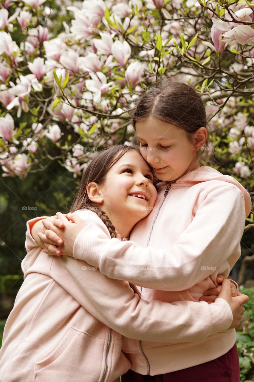 Two sisters hugging
