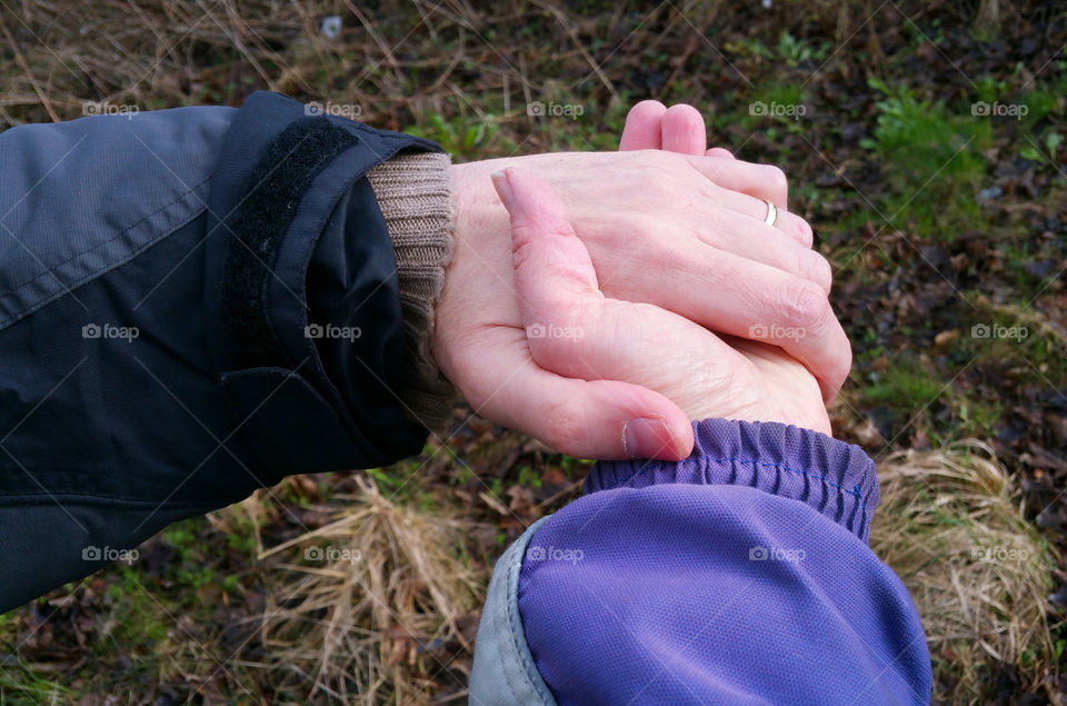 High angle view of couple holding hands