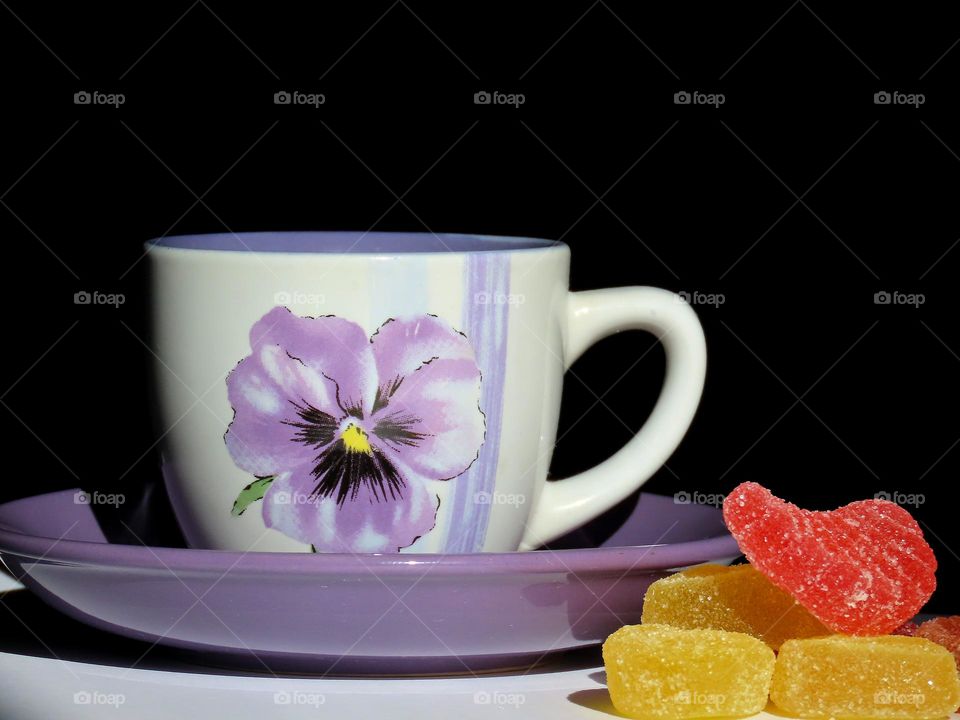 A cup of coffee and marmalade