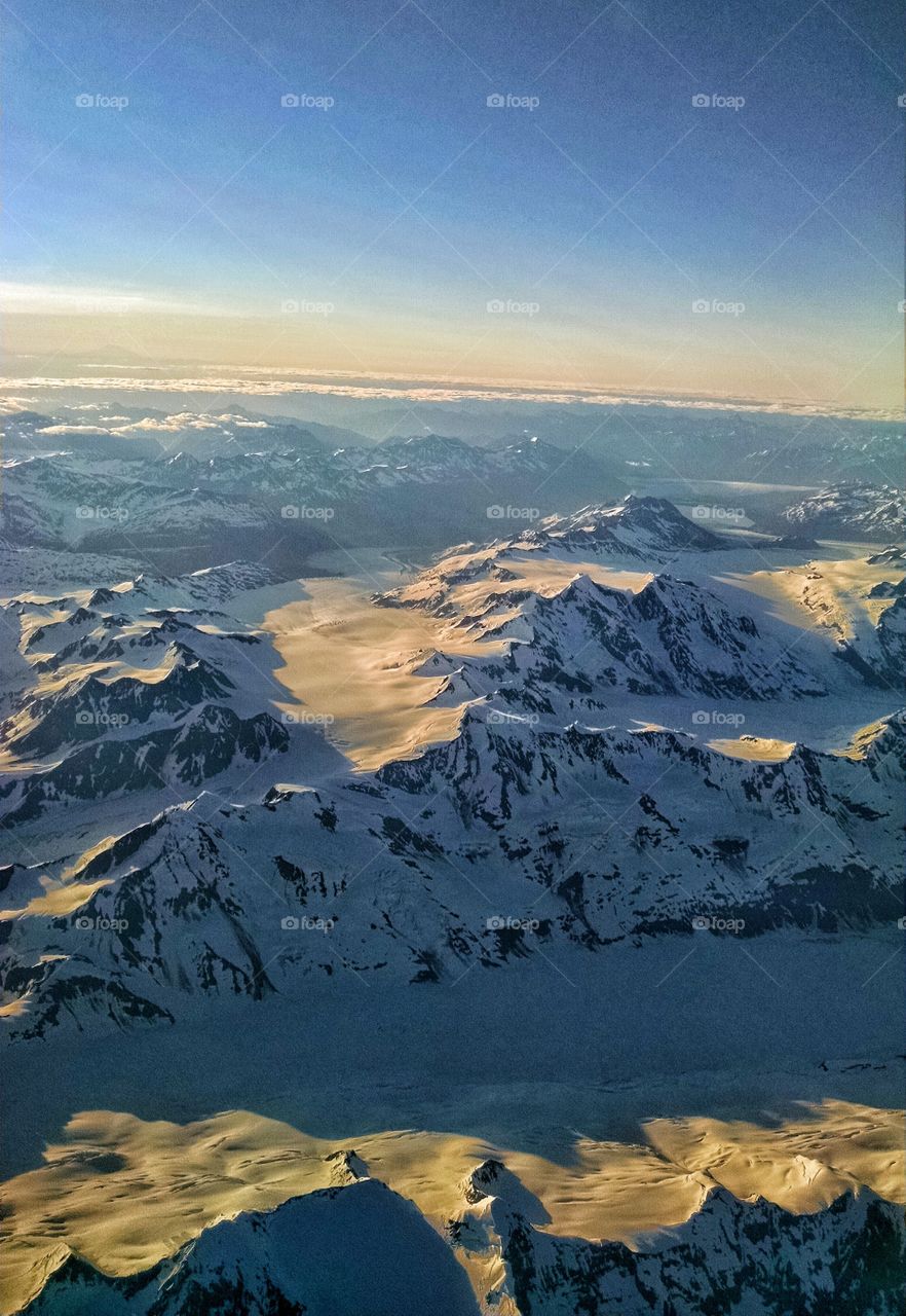 Frozen wilderness of Alaska glows in the evening light.