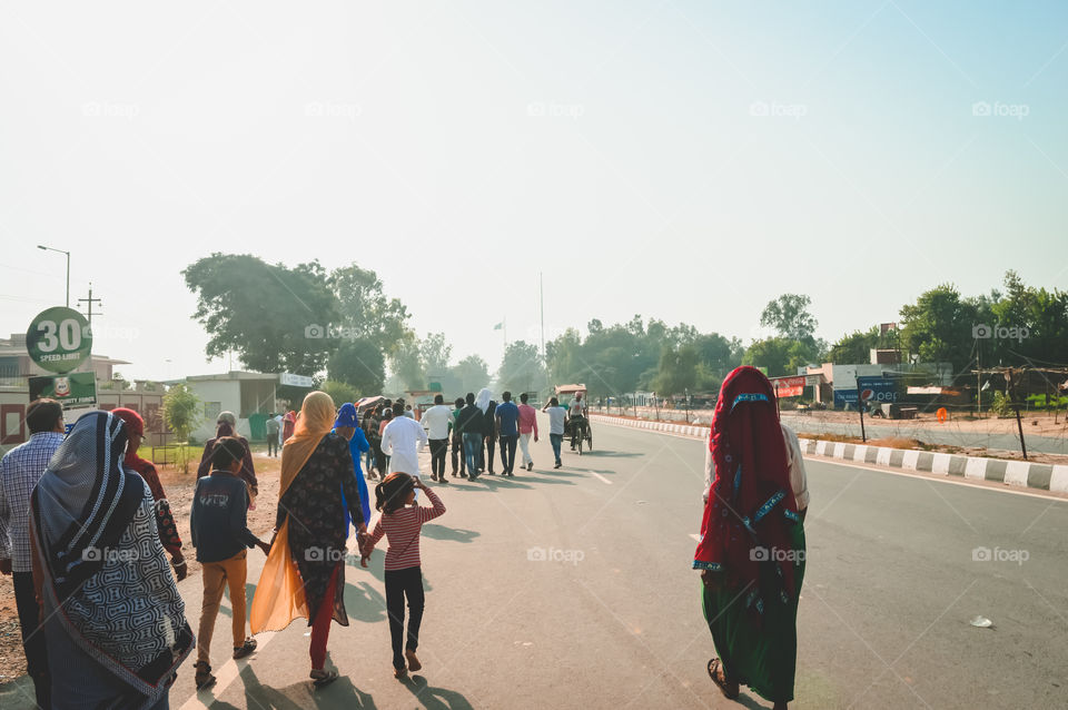 WAGHA BORDER, AMRITSAR, PUNJAB, INDIA - JUNE, 2017. People going to attend lowering of flags ceremony. Its a daily military practice security forces of India and Pakistan jointly followed since 1959.